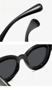 Detail view of smooth curved temples and integrated nose pads on black round sunglasses