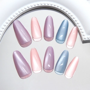 Cat eye press-on nails with pink, purple, and blue gradient in long oval shape