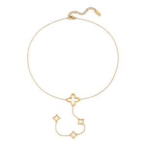 Macro shot of ST.STEEL hallmark on golden necklace with cutout floral pendants