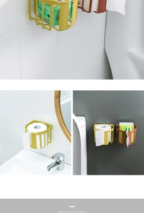 Close-up of wall-mounted tissue storage baskets in mustard yellow and brick red colors