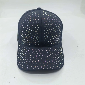Close-up of black cotton baseball cap featuring colorful sparkling rhinestone embellishments