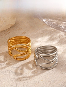 Detailed close-up of multi-layer 18K gold and silver plated geometric open rings