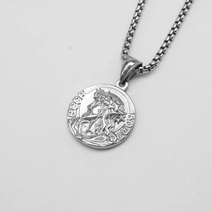 Detailed close-up of a silver Greek myth coin pendant with embossed lettering on a box chain