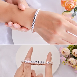Natural stone beaded bracelet with DAUGHTER letter charms and heart symbol detail