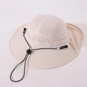 Close-up of beige kids sun hat featuring breathable mesh crown and wide brim