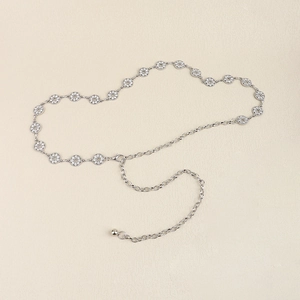 Detailed view of silver metal waist chain with rhinestone rings and adjustable lobster clasp