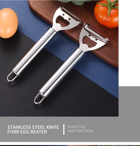 Dual-use stainless steel fruit peeler and bottle opener on a kitchen cutting board