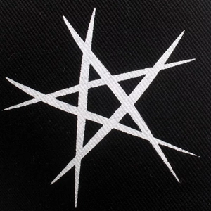 Detailed macro view of white unicursal hexagram printed on black twill fabric baseball cap
