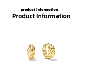 Detailed macro view of gold twisted metal hoop earrings with elegant spiral texture