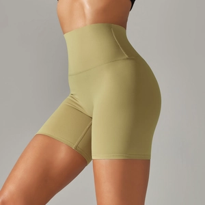 Detailed side view of high-waisted olive green yoga shorts showing body-shaping fit