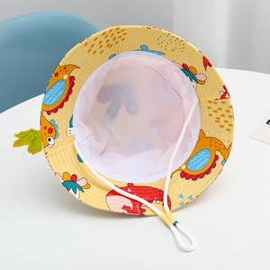 Detail of children's sun hat featuring dinosaur patterns, breathable mesh and size tag