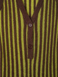 Detail of V-neck and striped texture on brown and yellow green knit sleeveless dress