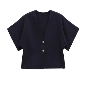 Detail of navy knit short sleeve cardigan with V-neck and decorative gold buttons