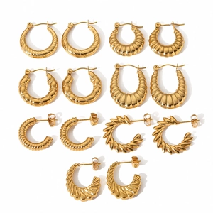 Set of seven pairs of 18K gold plated stainless steel hoops with various textures