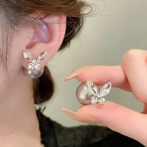 Elegant butterfly pearl earrings featuring gray pearls and sparkling rhinestones for women