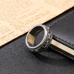 Vintage titanium steel ring for men featuring intricate vine textures on black leather