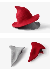 Close-up detail of red and grey knitted wizard hats showing fine wool texture