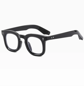 Detailed close-up of retro black round frame sunglasses with silver rivet accents
