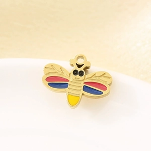Macro view of gold-plated stainless steel bee pendant with vibrant enamel colors