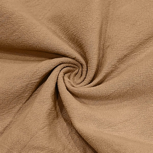 Macro view of brown linen fabric texture showing natural breathable fiber weave