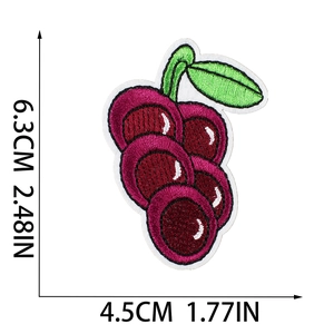 Detailed embroidery view of cherry fruit patch with dimensions 6.3cm by 4.5cm