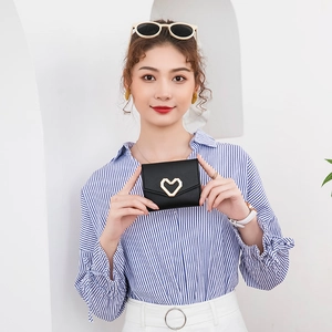 Mini black tri-fold heart wallet with cross-grain texture and gold heart buckle