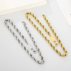Detail of silver and gold square pendant necklaces on twisted metal O-chains