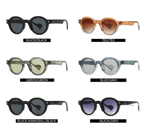 Detail of vintage round sunglasses with gold arrow rivets in six assorted frame colors