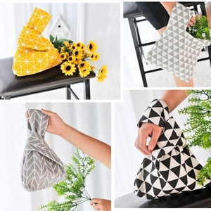 Japanese style knot wrist bag in cotton linen with various geometric floral patterns