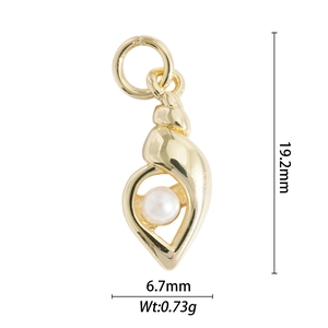 Macro detail of gold conch pendant with pearl inlay showing 19.2mm size and weight
