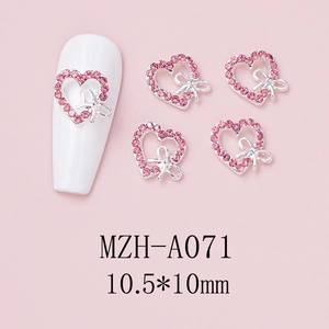 Detail of pink heart nail charms with hollow bow and rhinestones, size 10.5*10mm