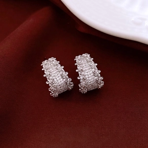 Elegant 14K gold plated silver needle hoop earrings with pavé crystals on red silk