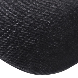 Macro shot of durable black twill fabric with triple reinforced stitching on baseball cap