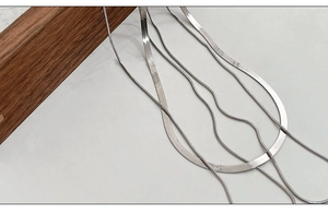 Macro detail of various flat and round Italian S925 silver snake bone chain styles