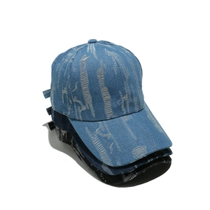 Distressed denim baseball caps in light blue, navy, and charcoal with vintage ripped texture