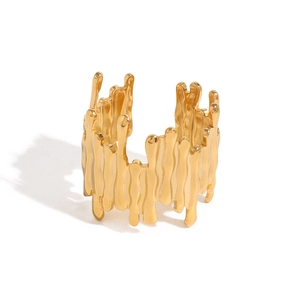 Irregular lava texture open ring in gold finish with minimalist geometric design