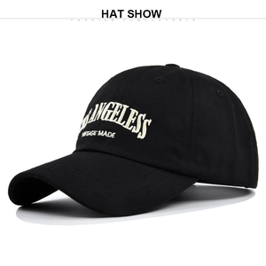 Detailed view of high-quality white embroidery on a black cotton baseball cap