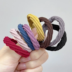 Close-up of multicolor high-elasticity ribbed hair ties in a seamless knit fabric