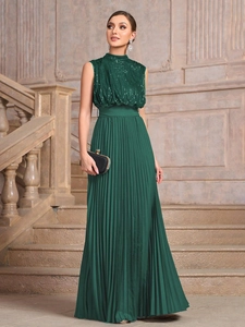 Elegant sleeveless dark green evening gown with sequined top and pleated skirt