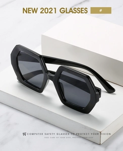 Detail of black geometric hexagonal frames on a luxury marble display stand