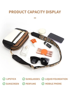 Flat lay of cowhide pattern crossbody bag with multiple zippers and daily essentials