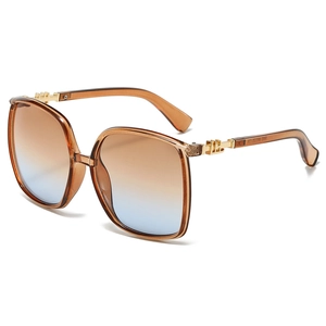 Minimalist oversized square sunglasses with brown gradient lenses and metal accents