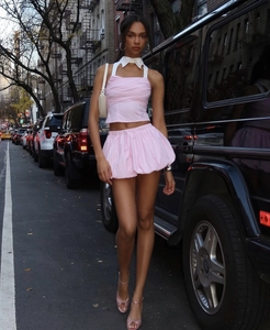 Pink and white striped two-piece set with halter neck top and puffed shorts