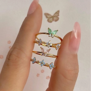 Set of four 18K gold plated rings with colorful zircon butterflies and blue flowers
