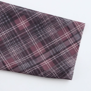 Close-up of purple and grey plaid mesh fabric showing breathable texture on white background