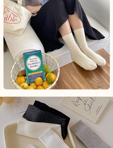 Detailed view of vertical ribbed crew socks in multiple neutral colors and model shot