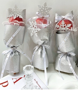 Detailed Christmas apple gift packaging with silver glitter paper and pearl lace decor
