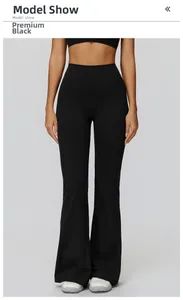 Front view of high waisted flared yoga pants in premium black showing slim fit design