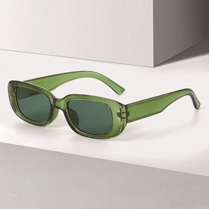 Retro small square sunglasses with green translucent resin frame and dark lenses