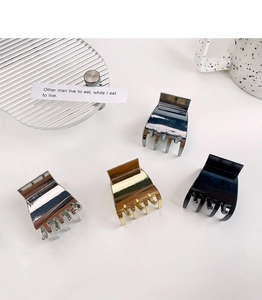 Set of four polished metal mini hair claws in gold, silver, gunmetal, and black finishes